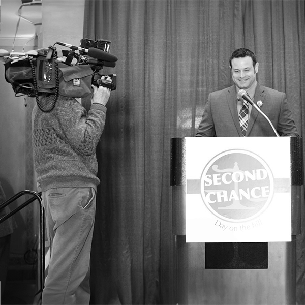 Rob Stewart speaking at a Second Chance Day on the Hill podium